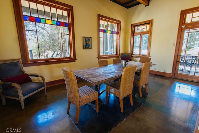 dining room featuring visible vents and baseboards