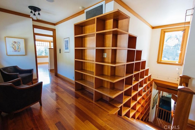 sitting room with visible vents, baseboards, ornamental molding, and dark wood-style flooring