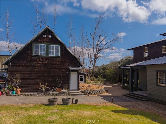 rear view of house with a lawn