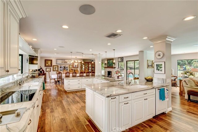1471 Rosehill, Redlands, CA 92373 - kitchen featuring a sink, open floor plan, a large island with sink, light wood-type flooring, and recessed lighting