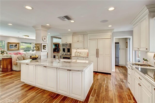 1471 Rosehill, Redlands, CA 92373 - kitchen featuring appliances with stainless steel finishes, a sink, light wood-style flooring, light stone countertops, and recessed lighting
