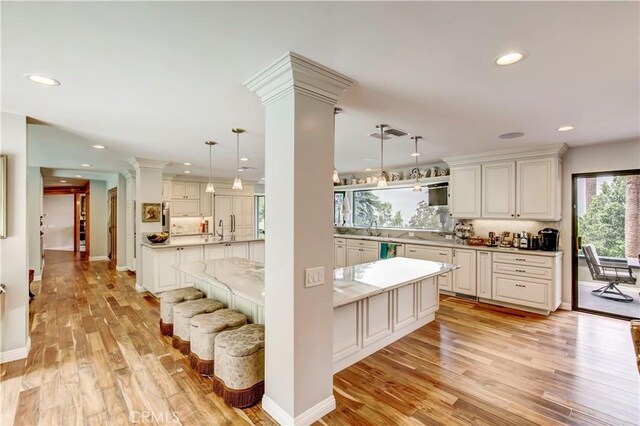 1471 Rosehill, Redlands, CA 92373 - kitchen featuring light wood-type flooring, backsplash, recessed lighting, hanging light fixtures, and light countertops