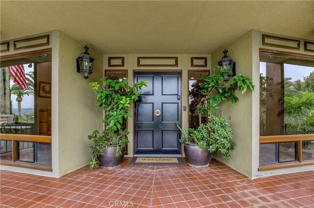 1471 Rosehill, Redlands, CA 92373 - property entrance featuring stucco siding and covered porch