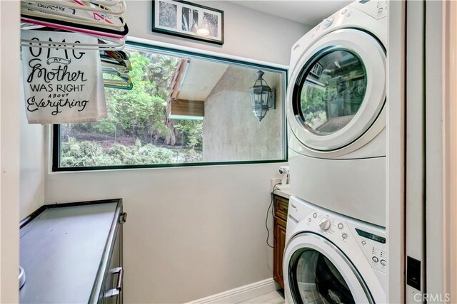 1471 Rosehill, Redlands, CA 92373 - laundry room featuring stacked washer / dryer, baseboards, and cabinet space