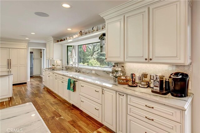 1471 Rosehill, Redlands, CA 92373 - kitchen with light wood finished floors, a sink, decorative backsplash, light stone countertops, and recessed lighting