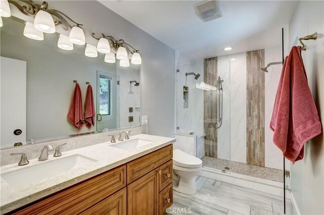 1471 Rosehill, Redlands, CA 92373 - full bathroom with a shower stall, toilet, double vanity, and recessed lighting