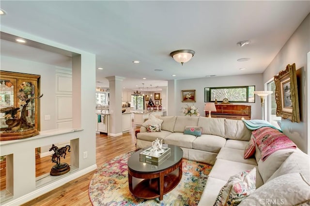 1471 Rosehill, Redlands, CA 92373 - living area featuring light wood-style floors, ornate columns, recessed lighting, and baseboards
