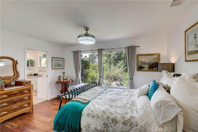 1471 Rosehill, Redlands, CA 92373 - bedroom with multiple windows, wood finished floors, and ensuite bath