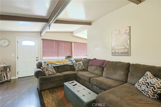 living area featuring lofted ceiling with beams and wood finished floors