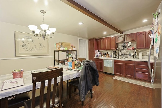 kitchen featuring an inviting chandelier, beam ceiling, a sink, light countertops, and stainless steel dishwasher