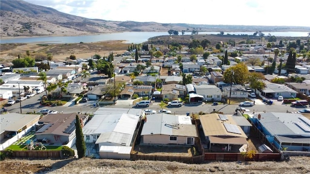 aerial view with a residential view and a water and mountain view