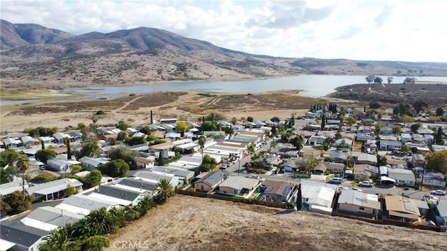 bird's eye view featuring a residential view and a water and mountain view