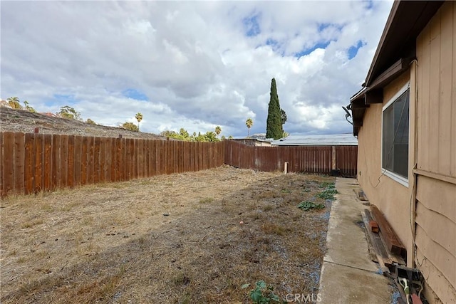 view of yard with a fenced backyard