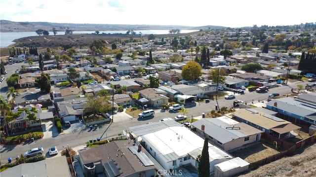 bird's eye view featuring a residential view and a water view