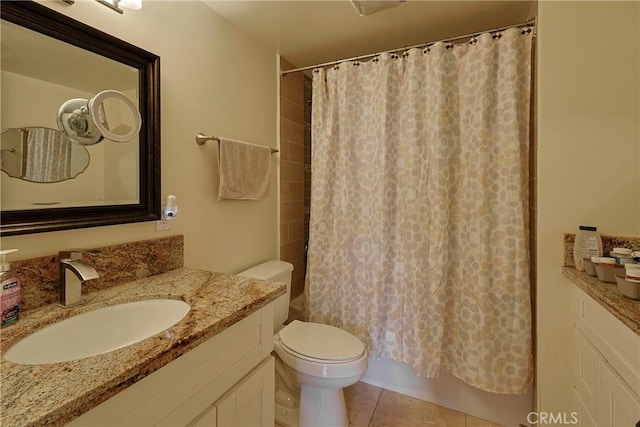 full bath with tile patterned floors, shower / bath combination with curtain, toilet, and vanity