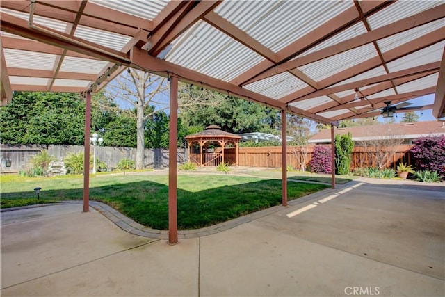 view of patio featuring a gazebo, a pergola, and a fenced backyard