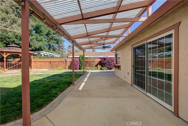 view of patio featuring a gazebo, fence, and a pergola