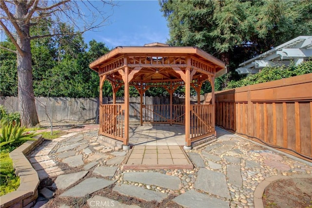 view of patio with a gazebo and a fenced backyard