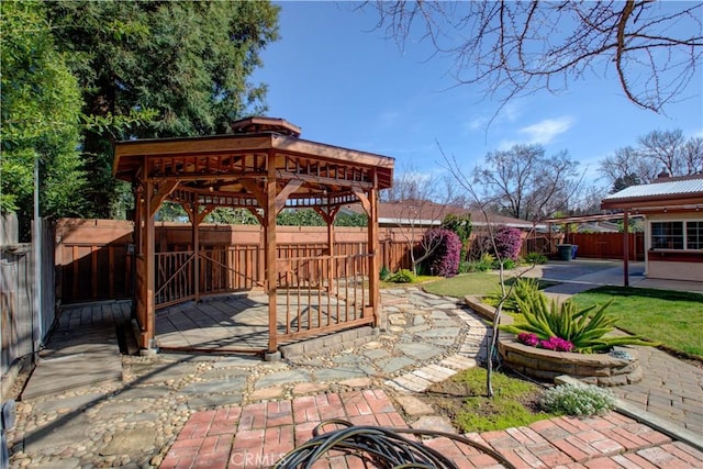 view of patio with a gazebo and a fenced backyard