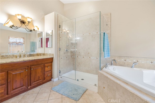 full bathroom featuring tile patterned floors, a shower stall, vanity, and a bath