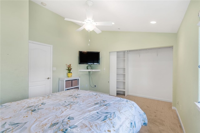 bedroom featuring a closet, baseboards, carpet, and vaulted ceiling