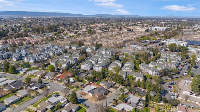 drone / aerial view featuring a residential view and a mountain view