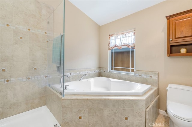 full bath featuring vaulted ceiling, toilet, a bath, and tiled shower