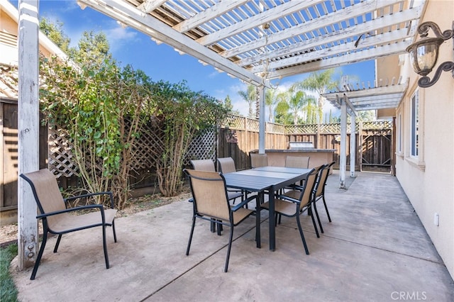 view of patio with a fenced backyard, outdoor dining space, and a pergola