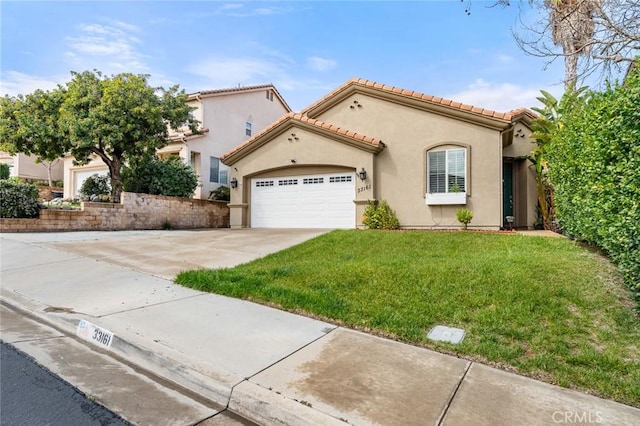 mediterranean / spanish home featuring stucco siding, a front lawn, driveway, a tile roof, and an attached garage