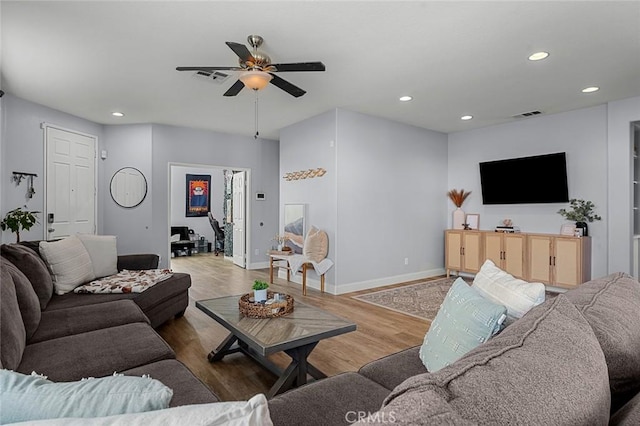 living room with recessed lighting, visible vents, wood finished floors, and ceiling fan