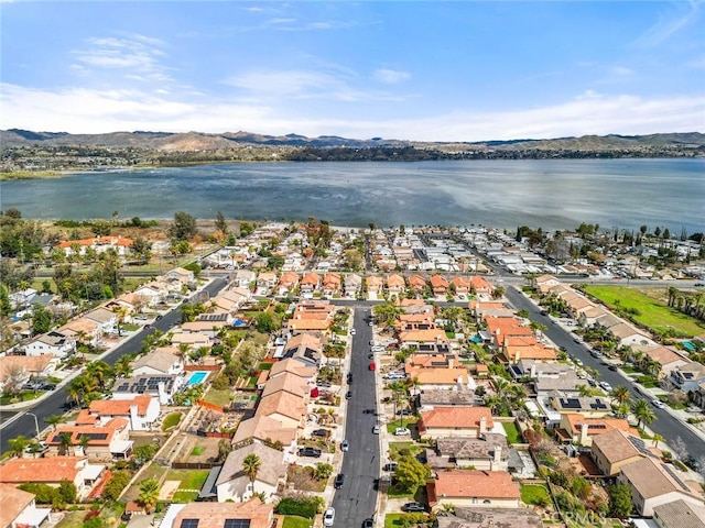 bird's eye view with a residential view and a water and mountain view