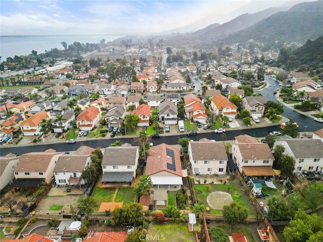 birds eye view of property featuring a residential view and a water view