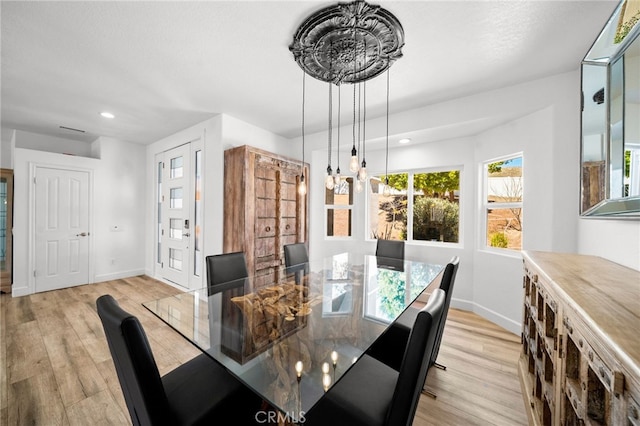 dining space with recessed lighting, baseboards, and light wood-style floors