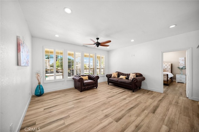 sitting room featuring recessed lighting, light wood-style floors, baseboards, and ceiling fan