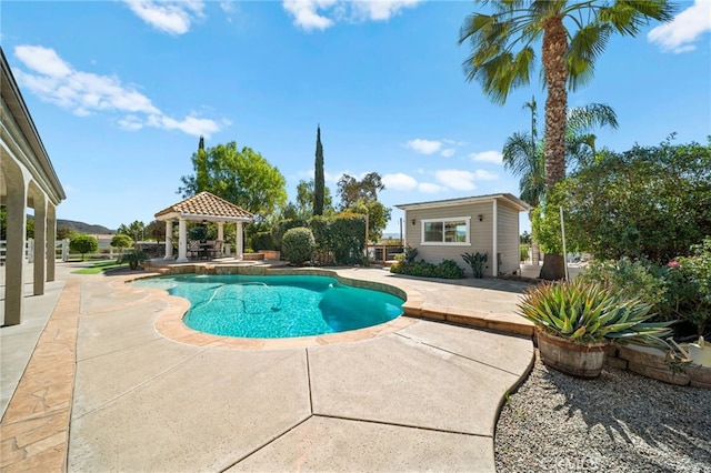 pool featuring a gazebo and a patio area