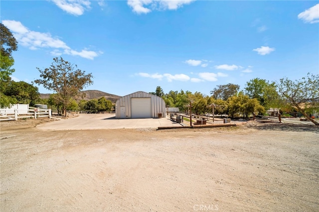 exterior space featuring a mountain view and fence