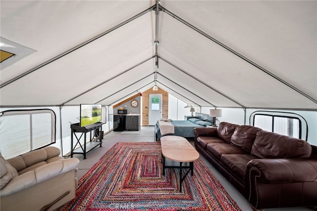 living area featuring vaulted ceiling