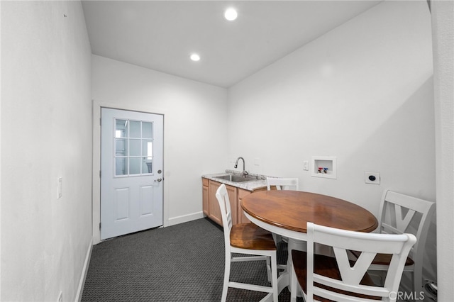 dining room with recessed lighting, baseboards, and dark carpet