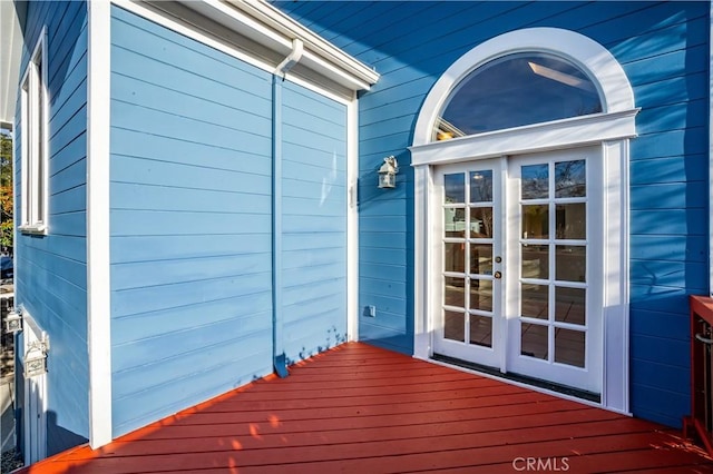 wooden deck featuring french doors