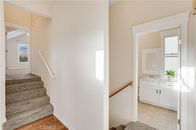 staircase with tile patterned floors