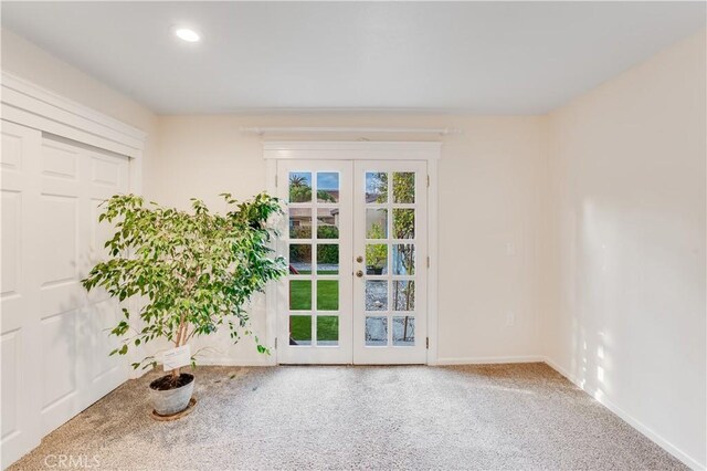 interior space featuring carpet, recessed lighting, french doors, and baseboards