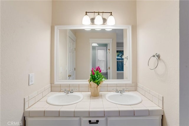 bathroom featuring double vanity and a sink