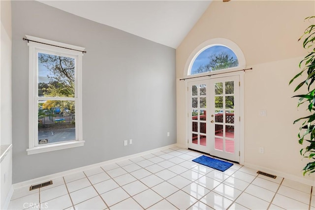 entryway featuring light tile patterned floors, visible vents, baseboards, and french doors