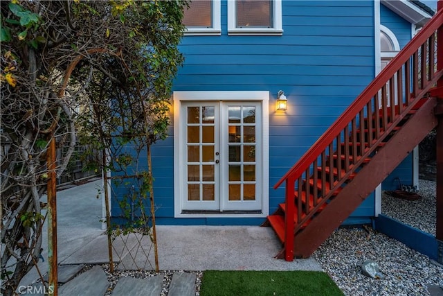 property entrance featuring french doors and a patio area