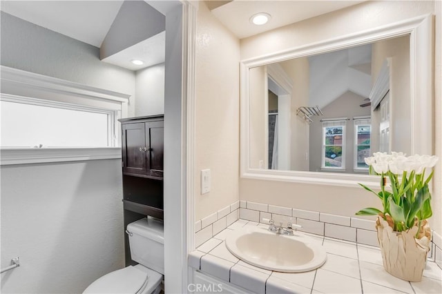 bathroom featuring recessed lighting, toilet, and vanity