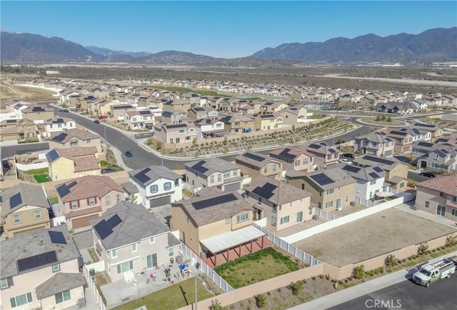 birds eye view of property with a mountain view and a residential view