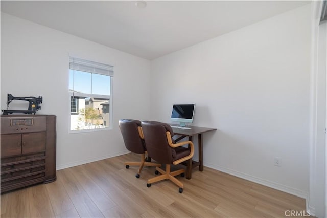 office with baseboards and light wood-type flooring