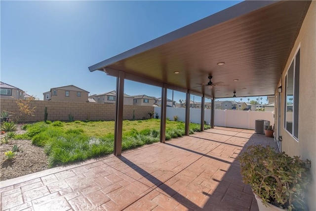 view of patio featuring cooling unit, a fenced backyard, and ceiling fan