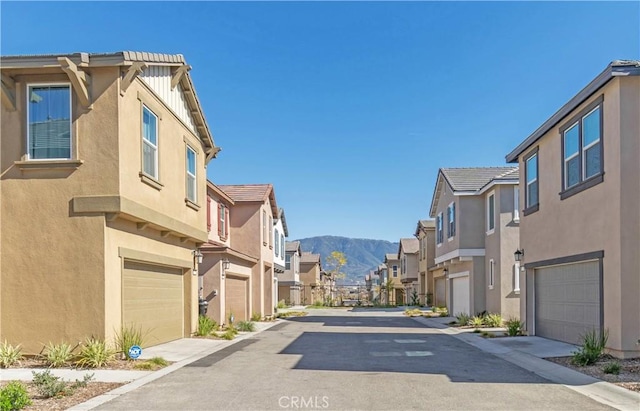 view of road with a mountain view and a residential view