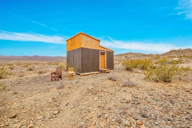 view of shed with a mountain view